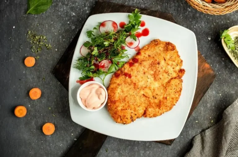 Parmesan Crusted Chicken with mayonaise in a with plate